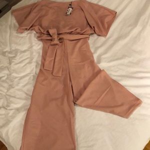 Slash neck tie waist culotte jumpsuit.